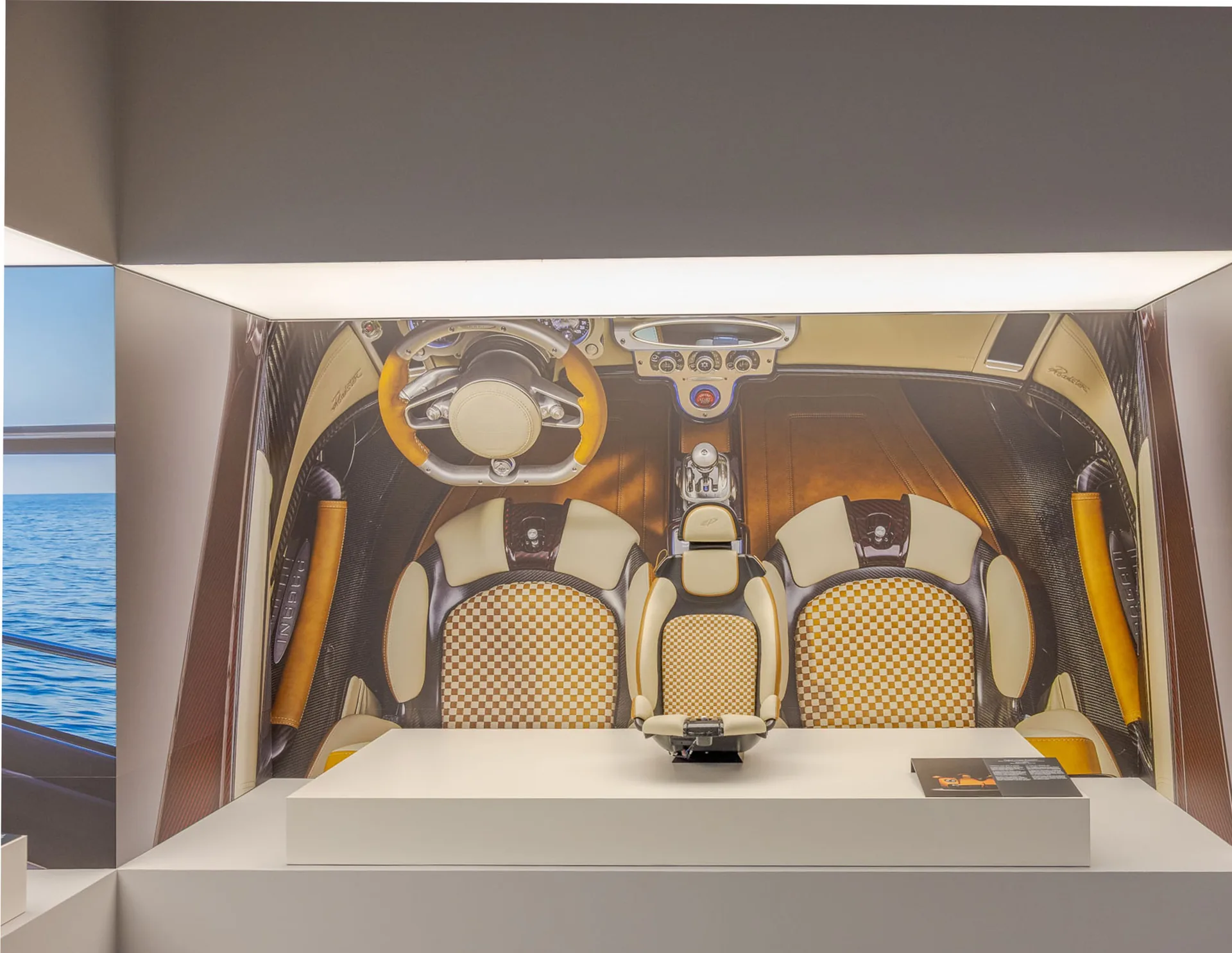 Poltrona Frau In Motion installation: a car interior with leather seats in a lit display